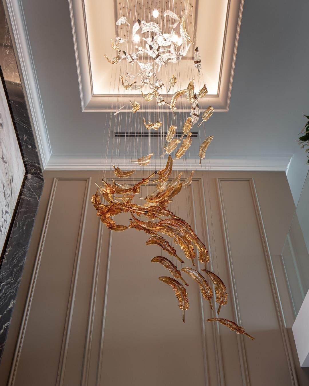 Aurelia cascade chandelier luxury LED chandelier India cascading chandelier for staircase and foyer lighting modern vertical chandelier with brushed gold finish designer LED chandelier for double height living room luxury chandelier for entrance hall and lobby contemporary chandelier with warm ambient lighting premium chandelier for modern interiors India elegant cascading light fixture for staircase void brushed gold chandelier for luxury home interiors modern suspension chandelier for dining area