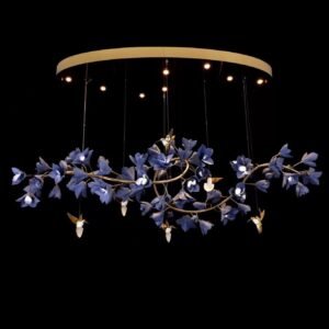 Celeste Bloom Linear Chandelier 1800mm – Luxury Floral LED Chandelier for Modern Interiors Elegant Linear Floral Chandelier with Soft Ambient Glow The Celeste Bloom Linear Chandelier (1800mm) is a sophisticated designer linear chandelier that brings the beauty of nature into modern interiors. Designed as an elongated floral composition, this luxury LED chandelier features delicately crafted blossoms arranged along a sleek metallic frame, creating a sense of movement and visual lightness. Each illuminated bloom emits a warm, diffused ambient glow, enhancing the atmosphere while maintaining balance within the space. The result is lighting that feels soft, refined, and perfectly suited for contemporary living. Designer Chandelier for Luxury Homes & Interiors in India Crafted using a premium metal structure with decorative acrylic floral elements, the Celeste Bloom Linear Chandelier blends artistic design with everyday functionality. The brushed gold frame combined with matte petal detailing adds warmth and elegance without overpowering the surrounding décor. Perfect for luxury homes, villas, dining areas, and hospitality spaces across India, this chandelier is designed for interiors where lighting acts as both a functional element and a statement feature. Why Choose the Celeste Bloom Linear Chandelier? • Unique linear floral chandelier design for modern spaces • Soft ambient LED lighting with diffused glow • Premium brushed gold finish with floral detailing • Ideal for long dining tables and feature lighting • Energy-efficient integrated LED modules • Suitable for residential and commercial interiors in India Ideal Placement for Maximum Impact The Celeste Bloom Linear Chandelier (1800mm) is best suited for: • Dining areas with long tables • Kitchen islands and modern layouts • Living rooms and lounge spaces • Boutique hospitality interiors • Feature ceilings in luxury homes Its 1800mm linear form makes it ideal for wide spaces where proportion and alignment matter. Frequently Asked Questions (AEO Optimized) What type of lighting does this chandelier provide? It provides warm ambient LED lighting, perfect for creating a soft and inviting atmosphere. Is it suitable for large dining tables? Yes, its linear 1800mm design makes it ideal for long dining tables and rectangular spaces. Does it fit modern interiors? Absolutely. Its minimal floral design and clean structure work beautifully in modern and contemporary interiors. Designed for Balanced, Nature-Inspired Interiors The Celeste Bloom Linear Chandelier is created for spaces where elegance feels effortless. It softens structured interiors while maintaining a refined presence—perfect for those who value modern luxury with organic design elements. Product Specifications Size: 1800 mm Product Type: Linear Designer Chandelier Style: Contemporary / Artistic / Nature Inspired Material: Metal Structure with Decorative Acrylic Floral Elements Finish: Brushed Gold Frame with Matte Petal Detailing Light Source: Integrated LED Modules Light Effect: Warm Ambient Diffused Glow Mounting Type: Ceiling Suspended Suspension Length: Adjustable Cables Energy Efficient: Yes Voltage Compatibility: Standard Residential Voltage Application: Indoor Use